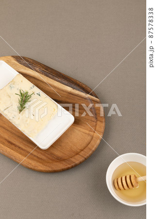 gorgonzola cheese and honey, brown background 87578338