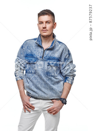 handsome young man in Jean jacket on white background handsome young man in Jean jacket on white background 87579237