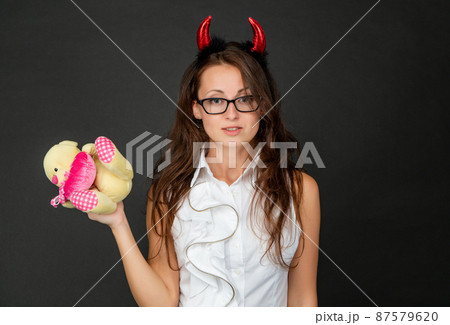 Halloween is coming. Businesswoman wear devil horns headband. Halloween party. Devil in disguise 87579620