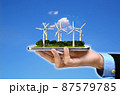 Wind Turbines Green Energy. Wind turbines plantation a smart phone . 3D Rendered image. 87579785