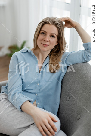 Portrait of a smiling confident and free young woman, lifestyle, comfort Portrait of a smiling confident and free young woman, lifestyle, comfort 87579812
