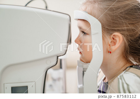 examination of the girl on the corneo topographer.modern clinic examination of the girl on the corneo topographer.modern clinic 87583112