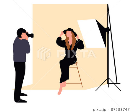 Professional photographers taking pictures. Men and woman models posing in professional photography studio with cameras and light tripods. 87583747