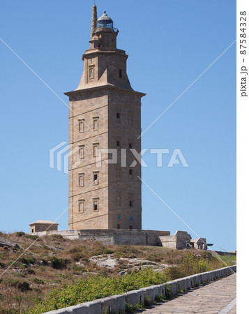 Promenade and tower of Hercules in A Coruna city in Spain - vertical 87584328