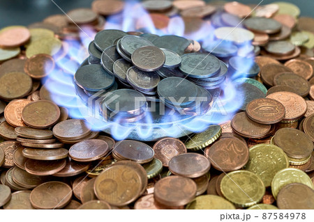 Euro metal coins burning in the gas stove Euro metal coins burning in the gas stove 87584978