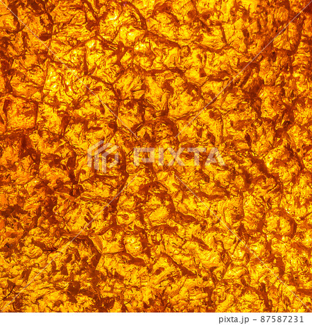 Natural amber texture. Multicolored background for advertising and banners. Vintage fossilized resin as a background. Red amber amber background. Close-up amber Natural amber texture. Multicolored background for advertising and banners. Vintage fossilized resin as a background. Red amber amber background. Close-up amber 87587231
