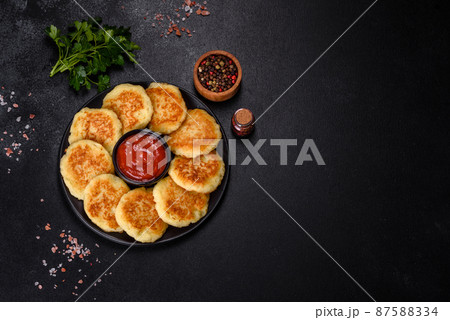 Potato Cakes. Vegetable fritters, latkes, hash browns. Vegetable pancakes 87588334