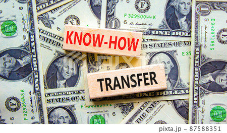 Know-how transfer symbol. Concept words Know-how transfer on wooden blocks on beautiful background from dollar bills, copy space. Business, innovation and know-how transfer concept. Know-how transfer symbol. Concept words Know-how transfer on wooden blocks on beautiful background from dollar bills, copy space. Business, innovation and know-how transfer concept. 87588351