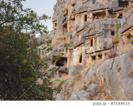 Archeological remains of the Lycian rock cut tombs in Myra, Turkey 87589619