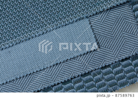 The background consists of several types of old colored tiles with different patterns on blue tone The background consists of several types of old colored tiles with different patterns on blue tone 87589763