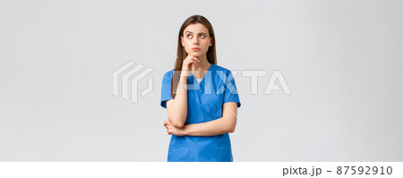 Healthcare workers, prevent virus, insurance and medicine concept. Thoughtful concerned female nurse or doctor thinking, solving problem in mind, look up and frowning, touch chin Healthcare workers, prevent virus, insurance and medicine concept. Thoughtful concerned female nurse or doctor thinking, solving problem in mind, look up and frowning, touch chin 87592910