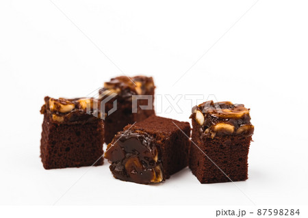 Delicious toffee cake on white background 87598284