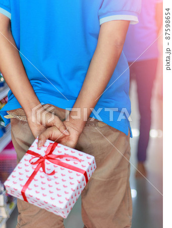 Man with giftbox Man with giftbox 87598654