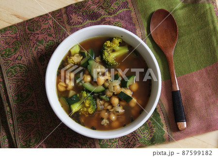 Close up of Bowl of Soup With Garbanzo Beans, Broccoli and Zucchini Close up of Bowl of Soup With Garbanzo Beans, Broccoli and Zucchini 87599182