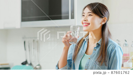Asian woman drink water 87601762