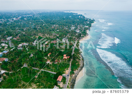 Aerial view on a city near the ocean. Sri Lanka 87605379