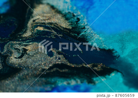 Alcohol ink art. Abstract design. Colorful paint background. Blue gold black colors blend. Alcohol ink art. Abstract design. Colorful paint background. Blue gold black colors blend. 87605659