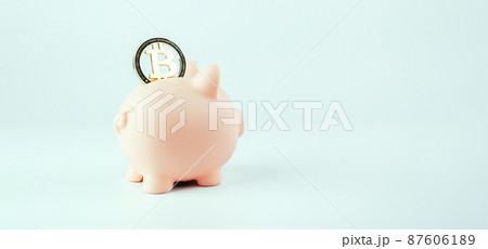 Save bitcoin money. Pink piggy bank with crypto coin BTC on white background. Saving currency money and financial concept bank. Save bitcoin money. Pink piggy bank with crypto coin BTC on white background. Saving currency money and financial concept bank. 87606189