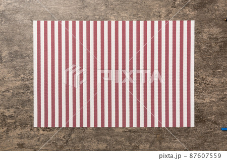 Top view of red tablecloth for food on cement background. Empty space for your design 87607559