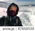 Young Man Smile Camera Taking Selfie Photo on top viewpoint mountain Zao, Yamagata. with snow monster background. 87608530