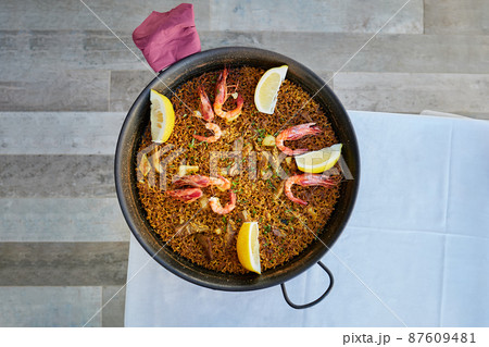 Traditional spanish seafood paella in the fry pan. ready to eat. cooking books concept 87609481