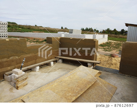 The Wooden framework for foundation in the land on background sky. 87612697
