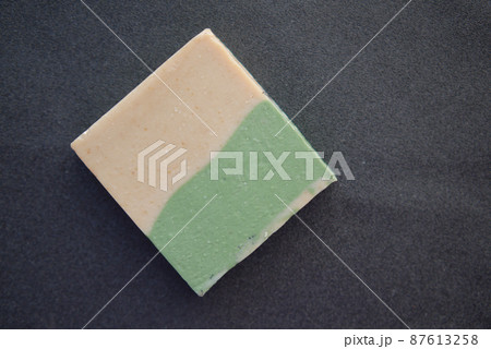 Homemade natural soap bar on black background Homemade natural soap bar on black background 87613258