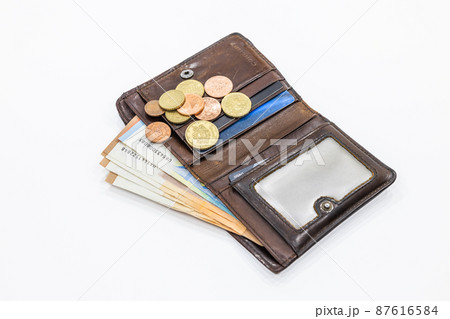 Open brown leather wallet with money and credit cards Open brown leather wallet with money and credit cards 87616584