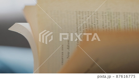 Woman hands close-up quickly flip through all the pages of the book. Woman hands close-up quickly flip through all the pages of the book. 87616775