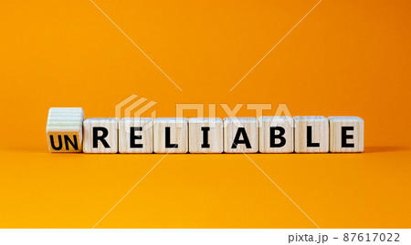 Unreliable or reliable symbol. Turned wooden cubes and changed the word unreliable to reliable. Beautiful orange background, copy space. Business and unreliable or reliable concept. Unreliable or reliable symbol. Turned wooden cubes and changed the word unreliable to reliable. Beautiful orange background, copy space. Business and unreliable or reliable concept. 87617022