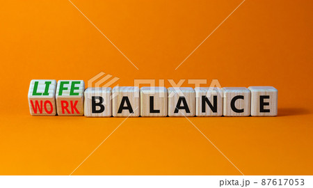 Work life balance symbol. Turned wooden cubes and changed concept words Work balance to Life balance. Beautiful orange table orange background. Business work life balance concept. Copy space. Work life balance symbol. Turned wooden cubes and changed concept words Work balance to Life balance. Beautiful orange table orange background. Business work life balance concept. Copy space. 87617053
