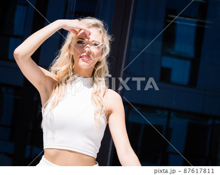 Blonde woman in city 87617811