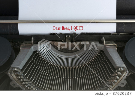 Text typed on an old classic typewriter - Dear boss, I quit. 87620237