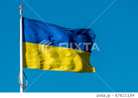 Ukraine flag on blue sky background Ukraine flag on blue sky background 87621194