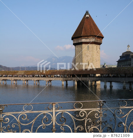 Chapel Bridge enlightened by the golden evening light. Chapel Bridge enlightened by the golden evening light. 87621309