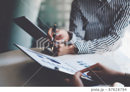 Fund managers team consultation and discuss about analysis Investment stock market by digital tablet. Fund managers team consultation and discuss about analysis Investment stock market by digital tablet. 87628794