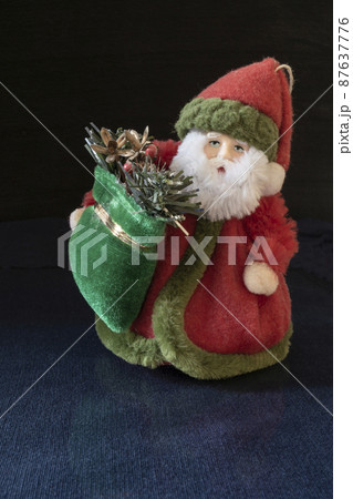 Grandparent Frost in caftan with bag toy on turn blue table 87637776