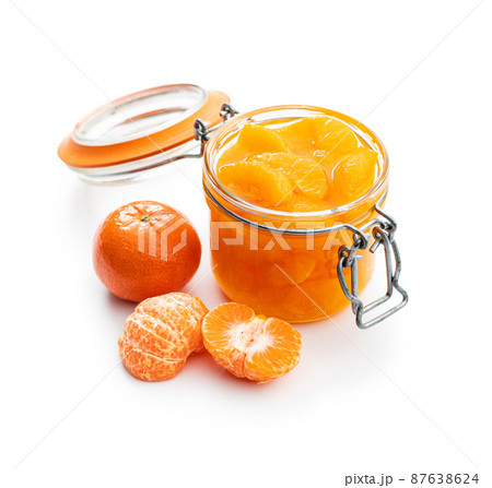 Canned tangerine. Pickled mandarin fruit in jar isolated on white background. Canned tangerine. Pickled mandarin fruit in jar isolated on white background. 87638624