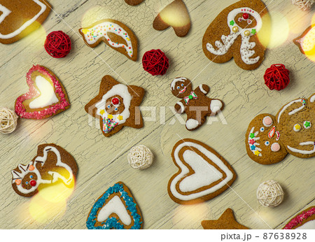 Many Christmas cookies on white wooden table Many Christmas cookies on white wooden table 87638928