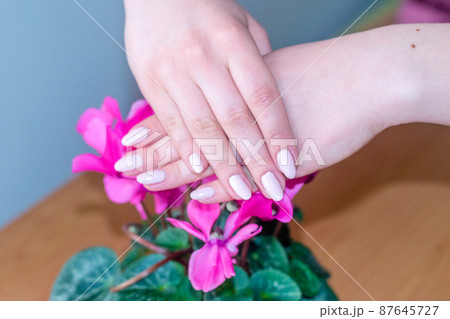 Beauty woman hands with pink fashion manicure. Beauty woman hands with pink fashion manicure. 87645727
