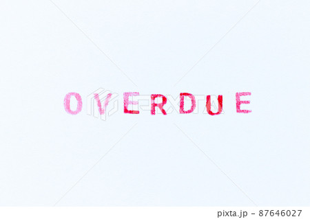 Red color ink rubber stamp in word overdue on white paper background 87646027