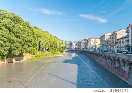 View of alpine river Dora Riparia at sunny day in Turin, Italy. View of alpine river Dora Riparia at sunny day in Turin, Italy. 87646176