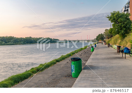Flotylla Wislana Vistulan Boulevards at sunset in Warsaw, Poland. 87646517
