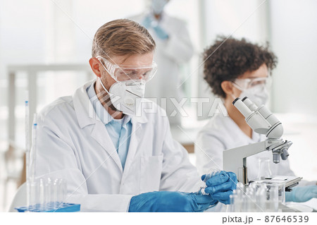 scientist testing samples in a laboratory. close-up. scientist testing samples in a laboratory. close-up. 87646539