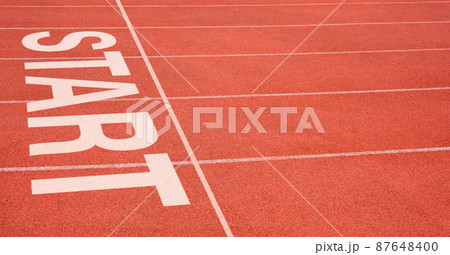 White imprint of the word START on running track, Starting point concept. White imprint of the word START on running track, Starting point concept. 87648400