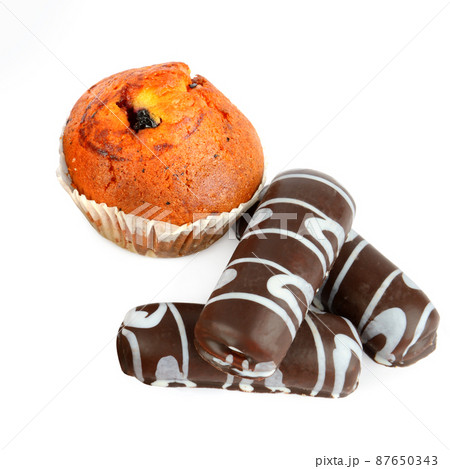Cookies and muffins isolated on white . 87650343