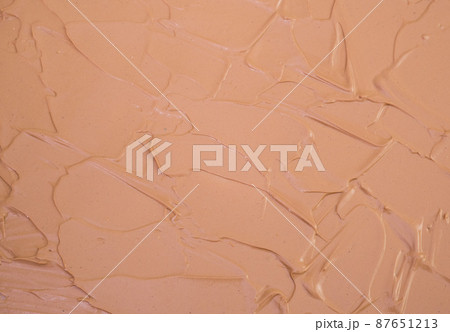 Makeup base cream blur, red clay mask texture. Background 87651213