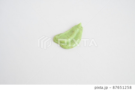 A sample of a natural green scrub on a white background. 87651258