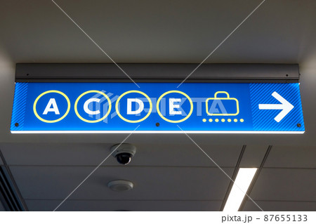 International Airport sign Gates A C D E in interior air terminal International Airport sign Gates A C D E in interior air terminal 87655133