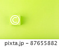 Minimal copyright and intellectual property protection concept on bright green background with copy space 87655882
